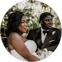 Bride and groom posing together outdoors in wedding attire.